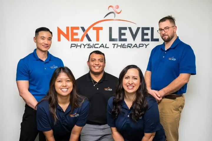 The Next Level Physical Therapy team in front of the clinic's Kingwood office