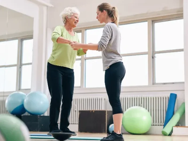 Patient working through guided mobility exercises with a therapist