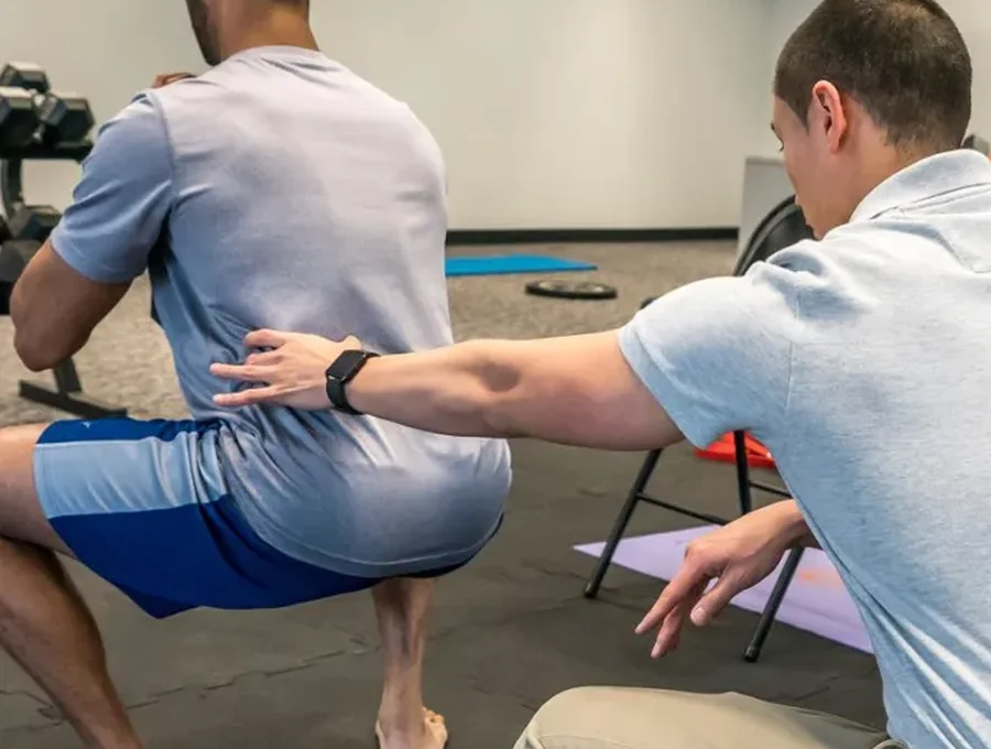 Physical therapist guiding a patient through a one-on-one session